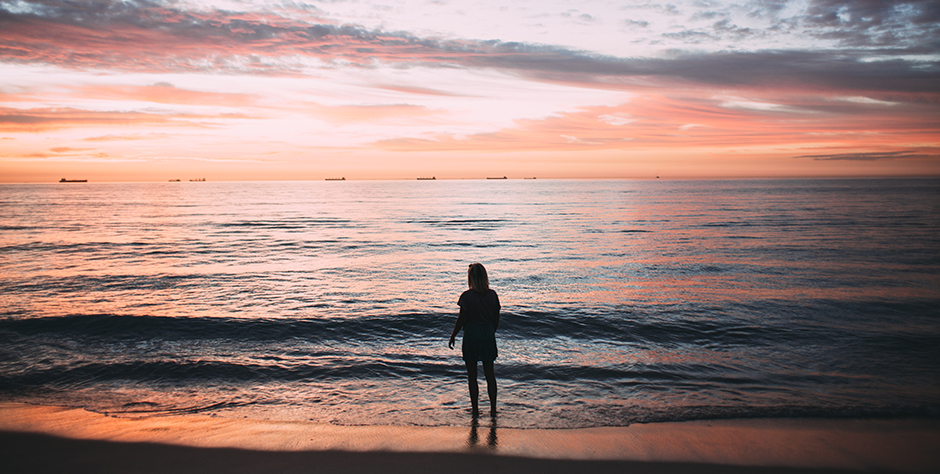 Woman on Beach with Sunset